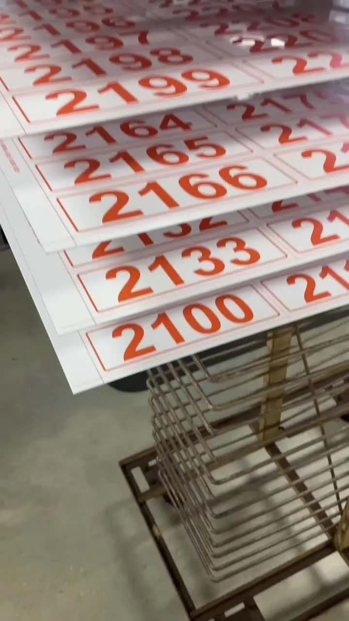 Racks of freshly printed serialized number plates