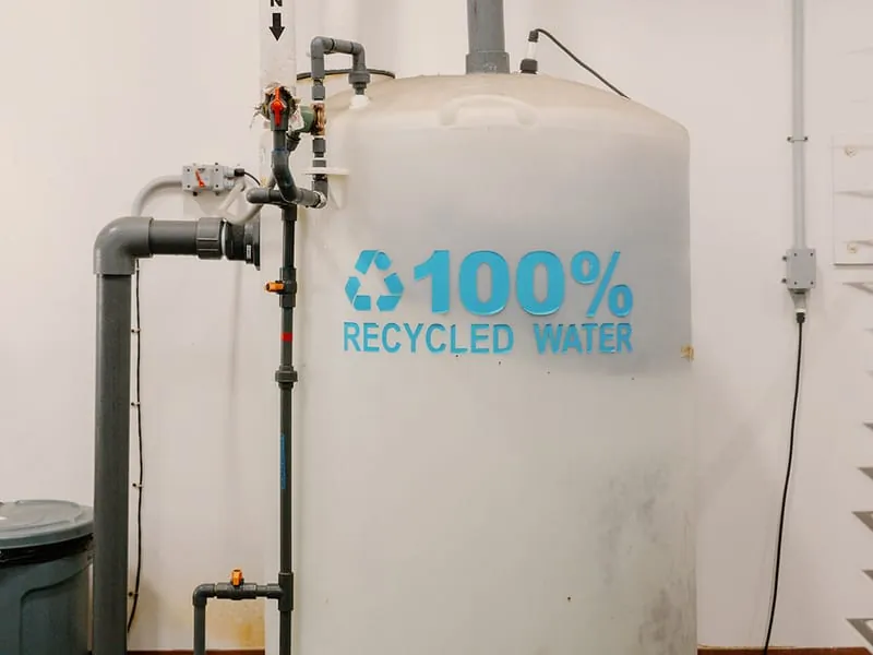 The plant's 100% recycled water tank, plumbed into the etching line