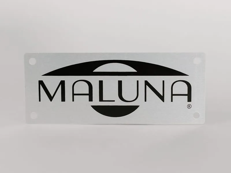 A brushed aluminum Maluna logo nameplate