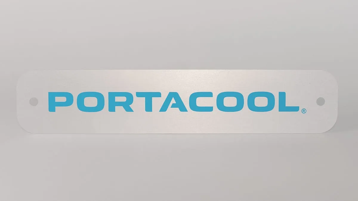 A brushed aluminum Portacool logo nameplate