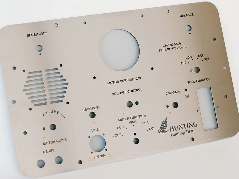 A brushed metal Hunting Titan control panel faceplate with engraved legends, speaker slots, and switch cutouts