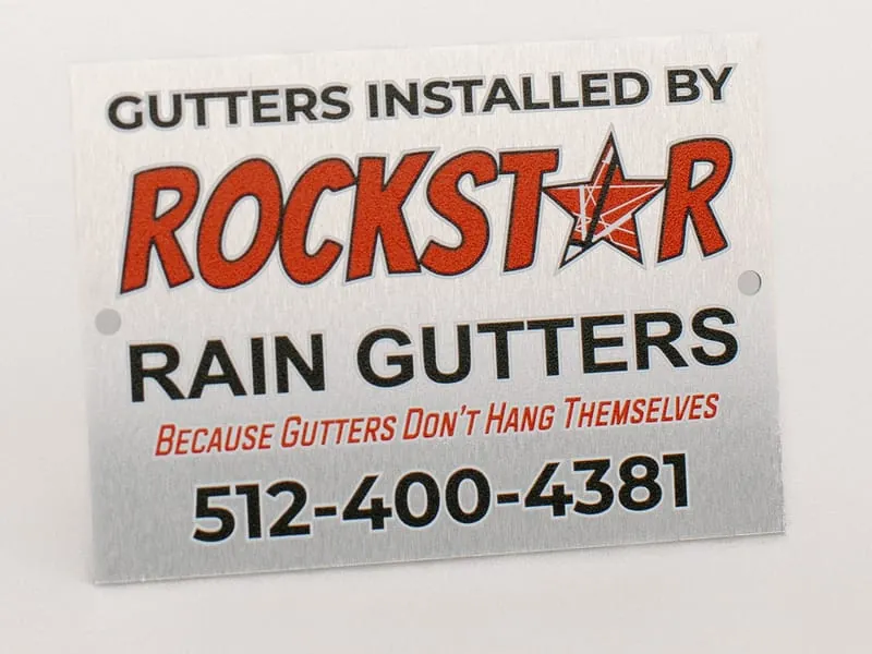 A full-color Rockstar Rain Gutters aluminum yard sign