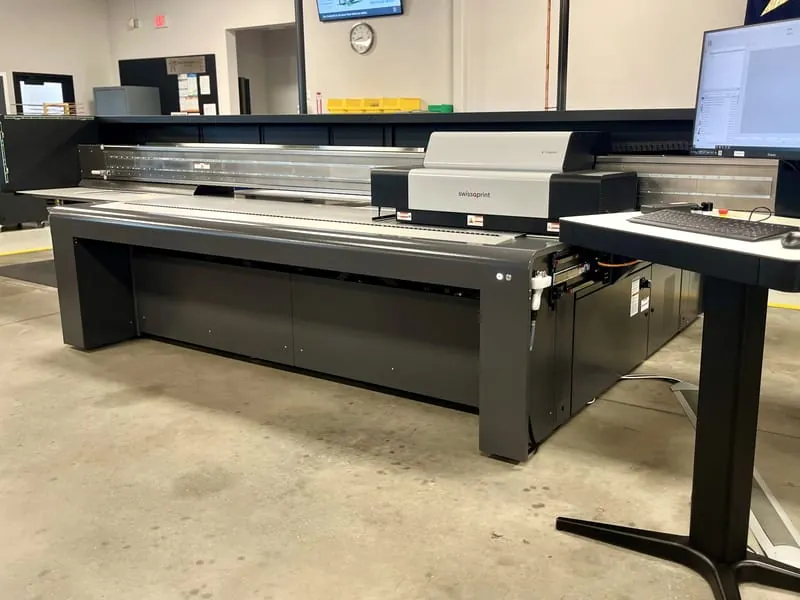 The swissQprint Impala flatbed digital printer on the production floor