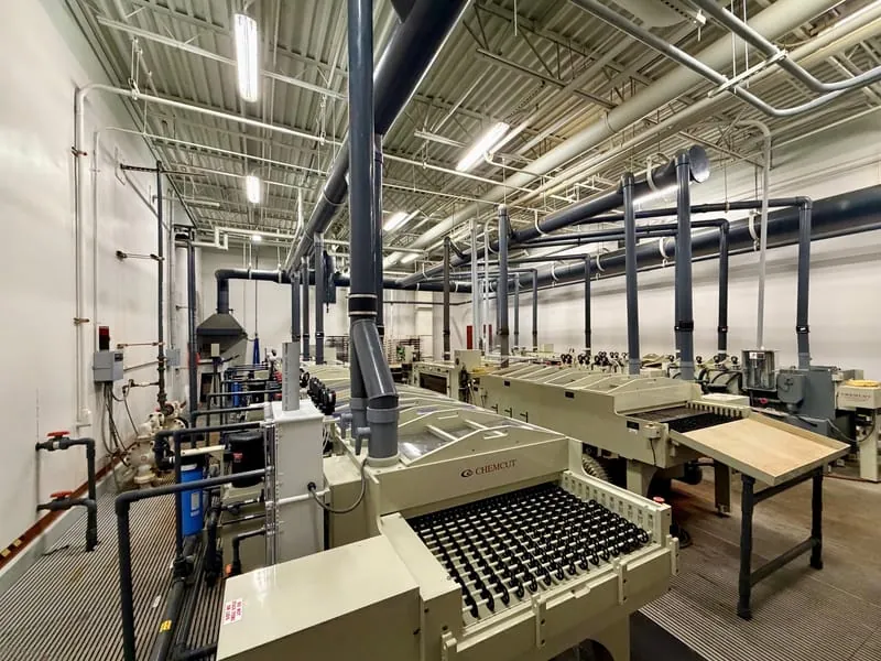 The Chemcut etching room with the full line, piping, and exhaust stacks