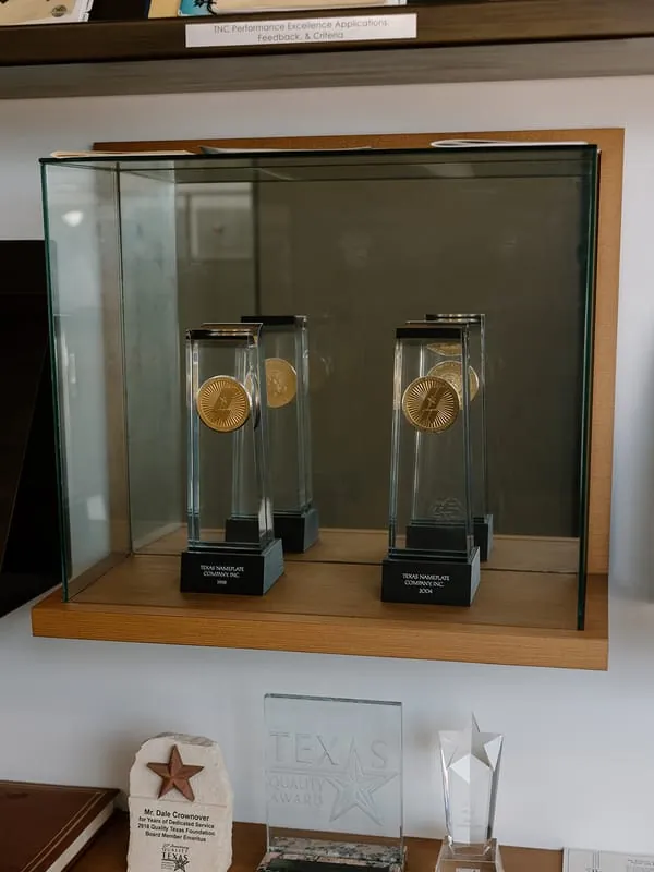 Two Malcolm Baldrige National Quality Award trophies engraved 1998 and 2004