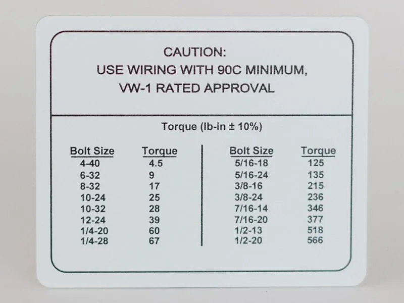 A caution decal with a bolt-size torque reference chart