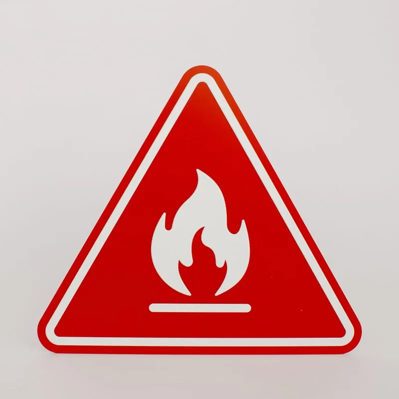A red triangular fire warning sign with a white flame pictogram