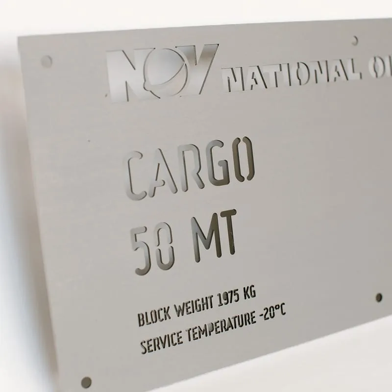 A close view of the cut-through lettering on the NOV cargo lifting plate