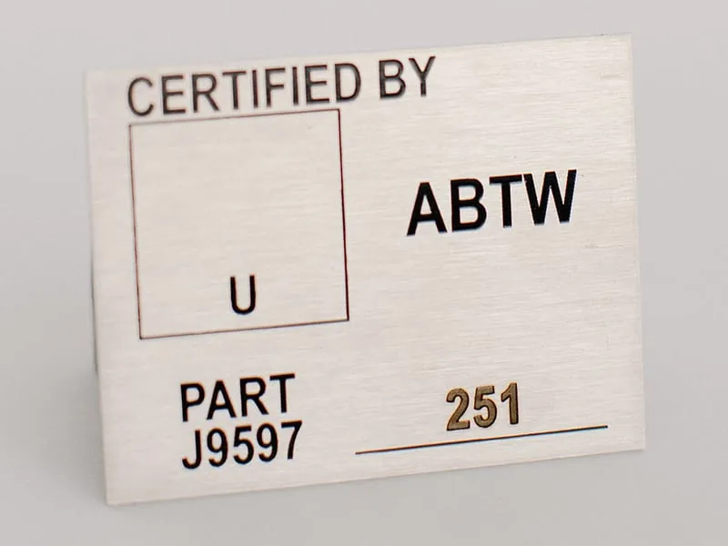 A laser-marked certification tag reading Certified By ABTW with part and serial numbers